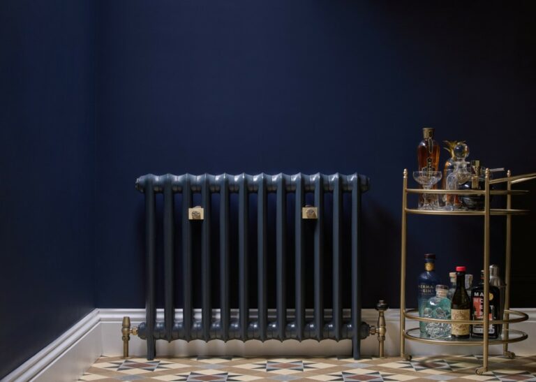 cast iron radiator with ornate radiator valves
